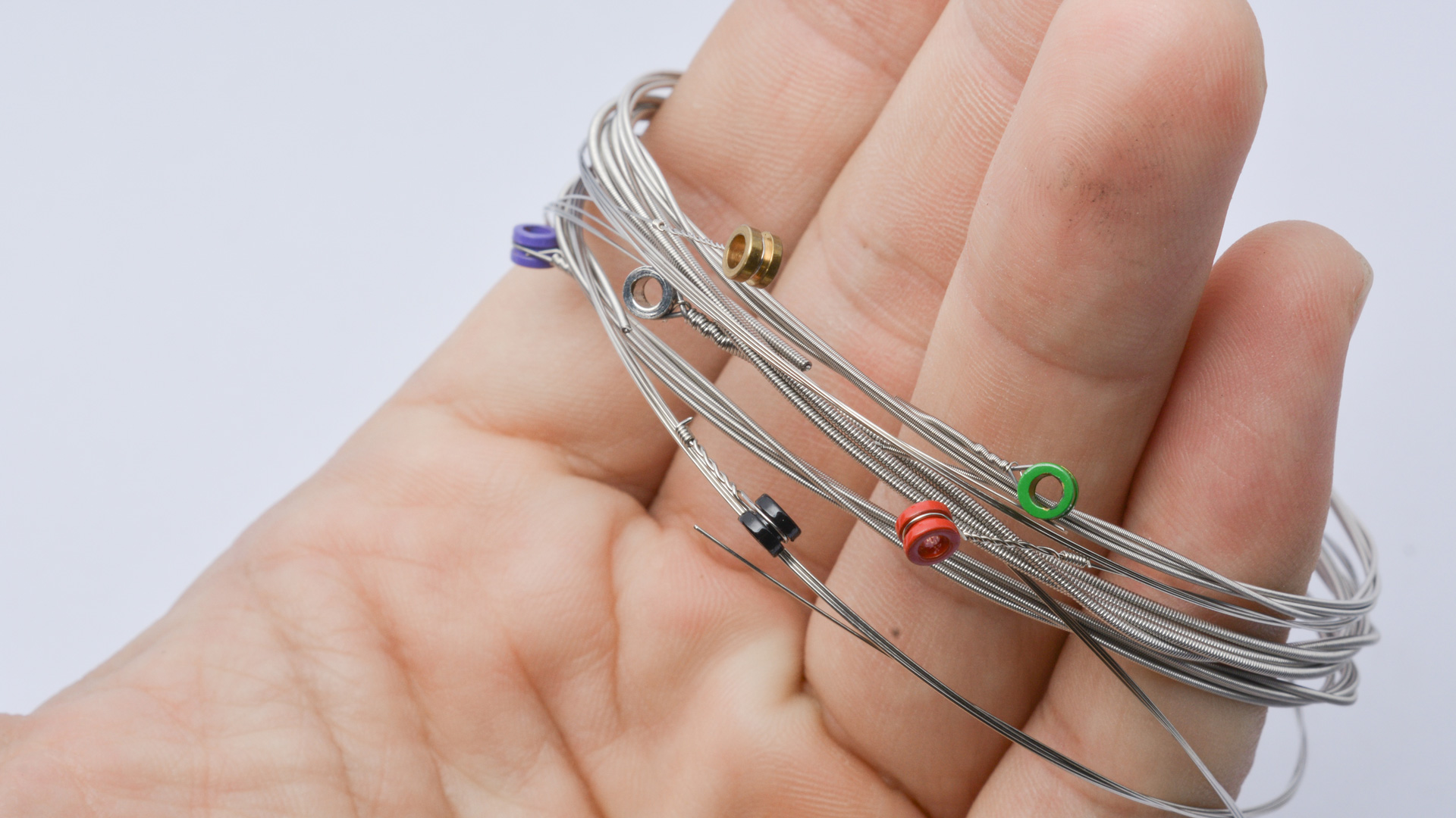 Guitar Strings in Hand